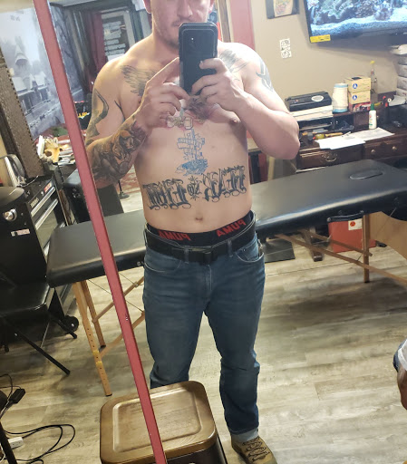 Explore texas tattoo ideas for men, creative tattoo ideas in Albany, available at The Curly Wolf Tattoo Club