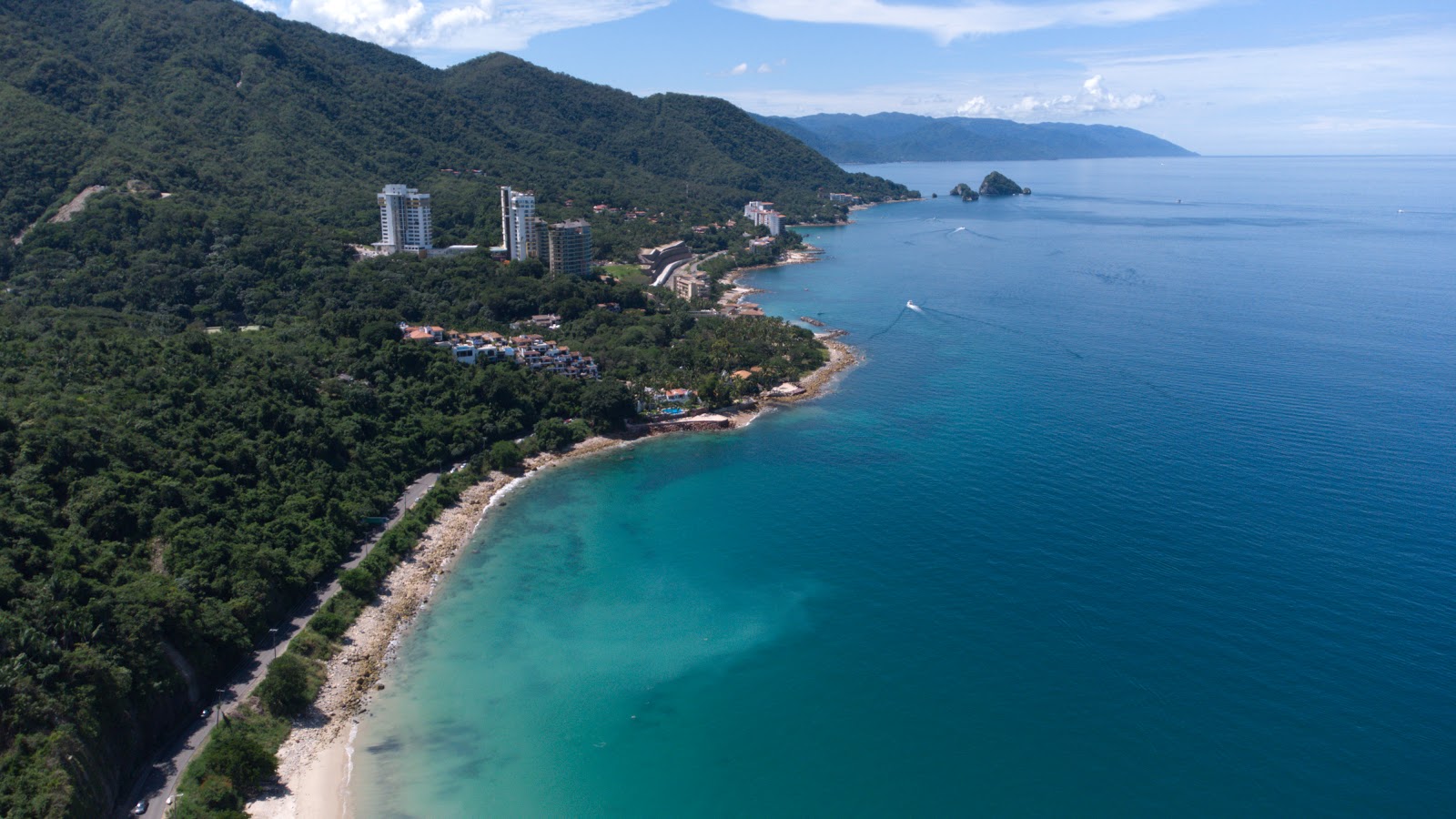 Fotografija Palmares beach in naselje