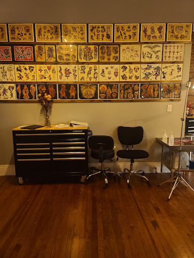 Explore fist tattoo ideas, creative tattoo ideas in Buffalo, available at The Tilted Rose Tattoo