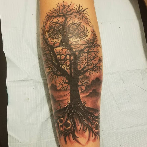 Explore giraffe tattoo ideas, creative tattoo ideas in Calhoun, available at A Sailors Grave Tattoo Parlor