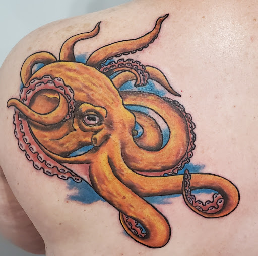 Explore ed hardy tattoo ideas, creative tattoo ideas in Kansas City, available at Golden Stag Tattoo and Gallery