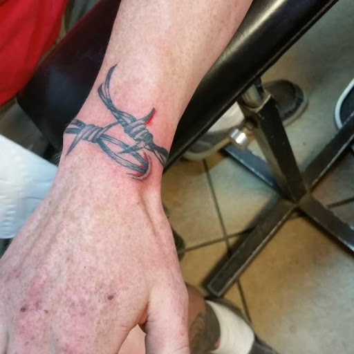 Explore half sleeve flower tattoo ideas, creative tattoo ideas in Elko, available at Tom Custom Tattoos and Body Piercing Studio