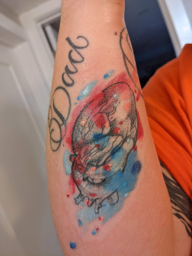 Explore baby footprint tattoo ideas, creative tattoo ideas in Rockford, available at Delicious Ink Tattoo & Piercing