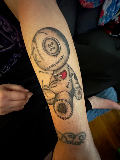 Explore floral hand tattoo ideas, creative tattoo ideas in High Point, available at 21 Aces Tattoo Co.