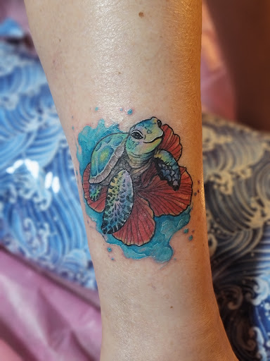 Explore tattoo ideas tribal arm, creative tattoo ideas in Hillsboro, available at Reflections Art Gallery and Studio