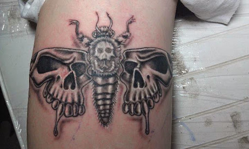 Explore ripped skin tattoo ideas, creative tattoo ideas in Lagrangeville, available at Black Cherry Tattoo Studio NY