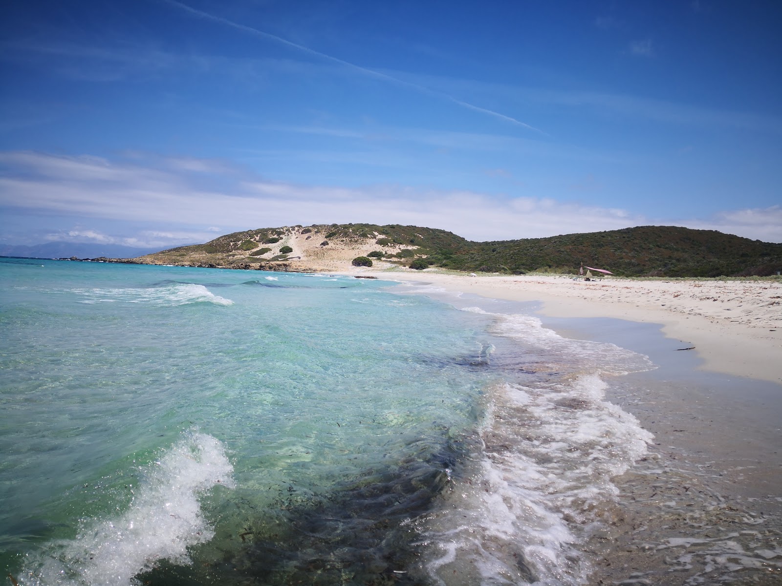 Photo of Ghignu beach with turquoise pure water surface