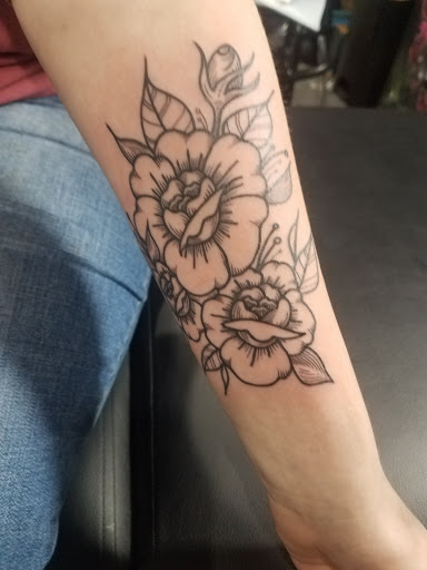Explore hand tattoo ideas for man, creative tattoo ideas in Auburn, available at Against All Odds Tattoo