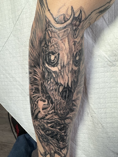 Explore bottom leg tattoo ideas, creative tattoo ideas in Oak Forest, available at Silver Raven Tattoos