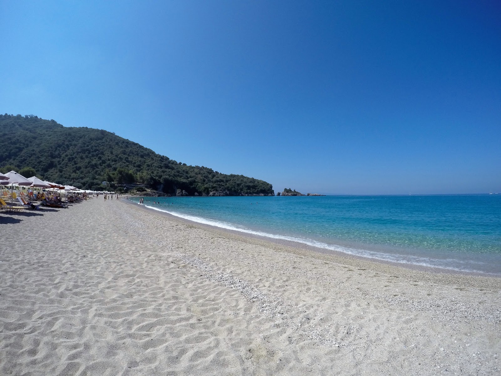 Photo of Karavostasi beach with turquoise pure water surface