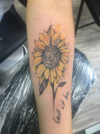 Explore name tattoo ideas on neck, creative tattoo ideas in Los Angeles, available at South Central Tattoos