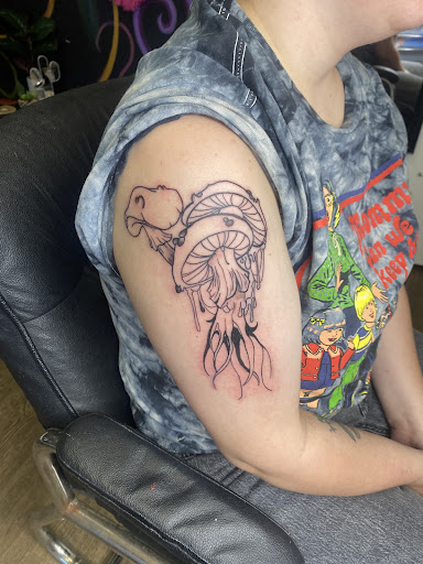 Explore dirtbike tattoo idea, creative tattoo ideas in Lake City, available at Crooked Spines Tattoo Studio