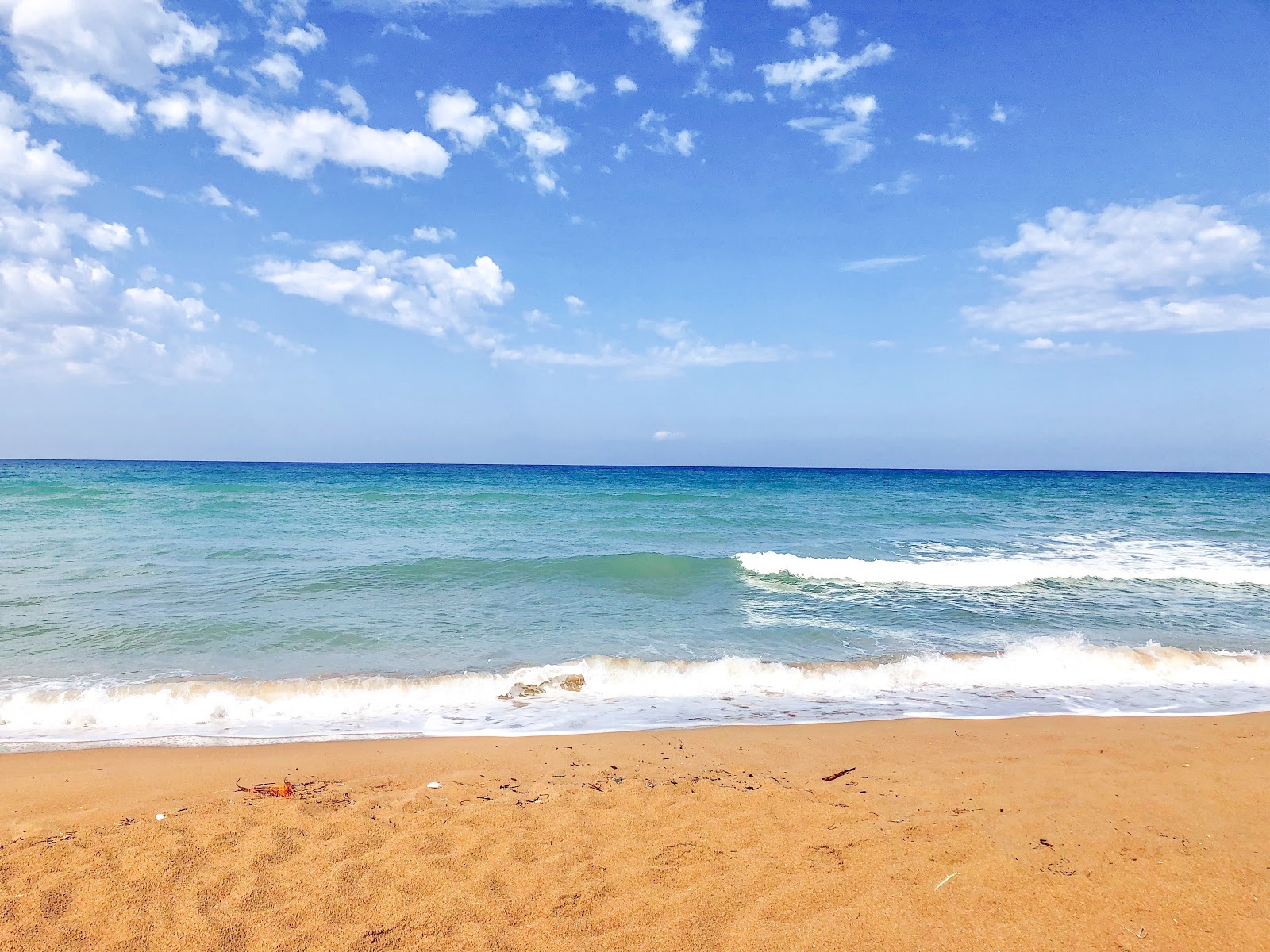 Foto van Apollo Camping beach met turquoise water oppervlakte