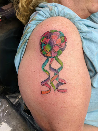 Explore tramp stamp tattoo cover up ideas, creative tattoo ideas in Southport, available at Inklanation Custom Tattoos