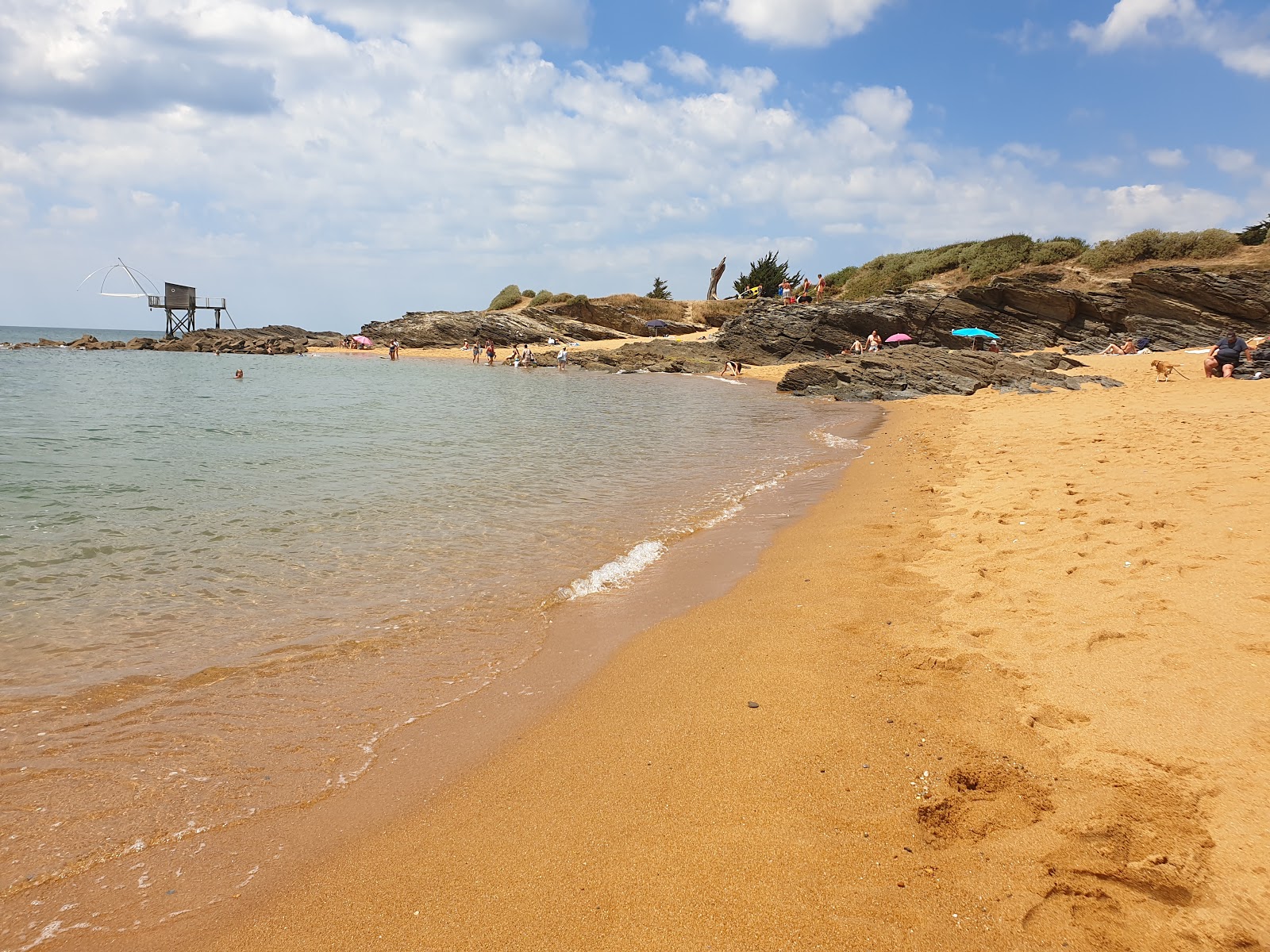 Portmain beach的照片 带有碧绿色纯水表面