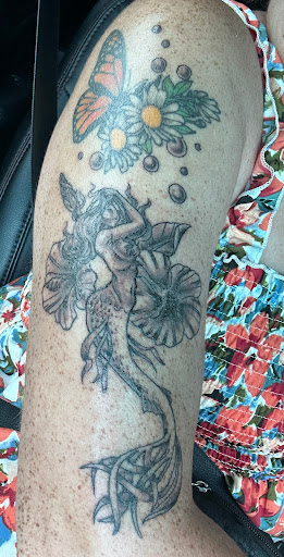 Explore rock n roll tattoo ideas, creative tattoo ideas in Clearwater Beach, available at Psychotic Ink