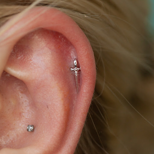 Explore barb wire tattoo ideas, creative tattoo ideas in Boston, available at Arcadia Body Piercing