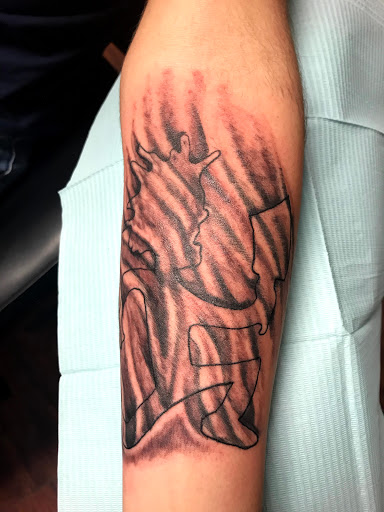 Find tattoo ideas of trees for your next unique tattoo in Seymour at American Gypsy Tattoo Corp.