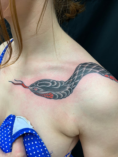 Explore middle neck tattoo ideas, creative tattoo ideas in Strasburg, available at Champion Tattoo Company