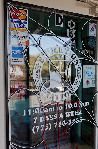 Explore ribbon tattoo ideas, creative tattoo ideas in Reno, available at Evolution Tattoo