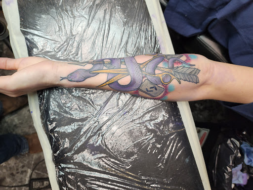 Explore feather tattoo ideas for men, creative tattoo ideas in Yankton, available at Exquisite Ink