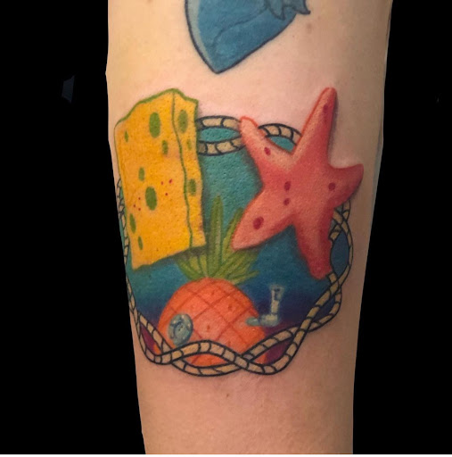 Explore small book tattoo ideas, creative tattoo ideas in Bryant, available at Goon Tattoo