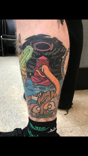 Explore lily flower tattoo ideas, creative tattoo ideas in Logan, available at Surreal Ink Tattoo & Body Piercing