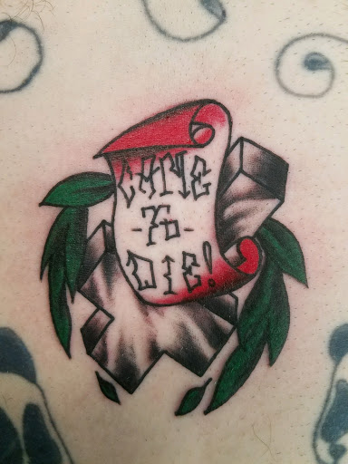 Explore dog bone tattoo ideas, creative tattoo ideas in Muncie, available at The Tattoo Studio