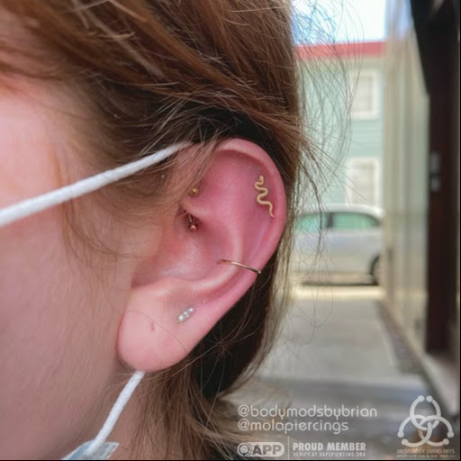 Explore feminine cover up tattoo ideas, creative tattoo ideas in Charleston, available at MOLA Piercing and Fine Jewelry