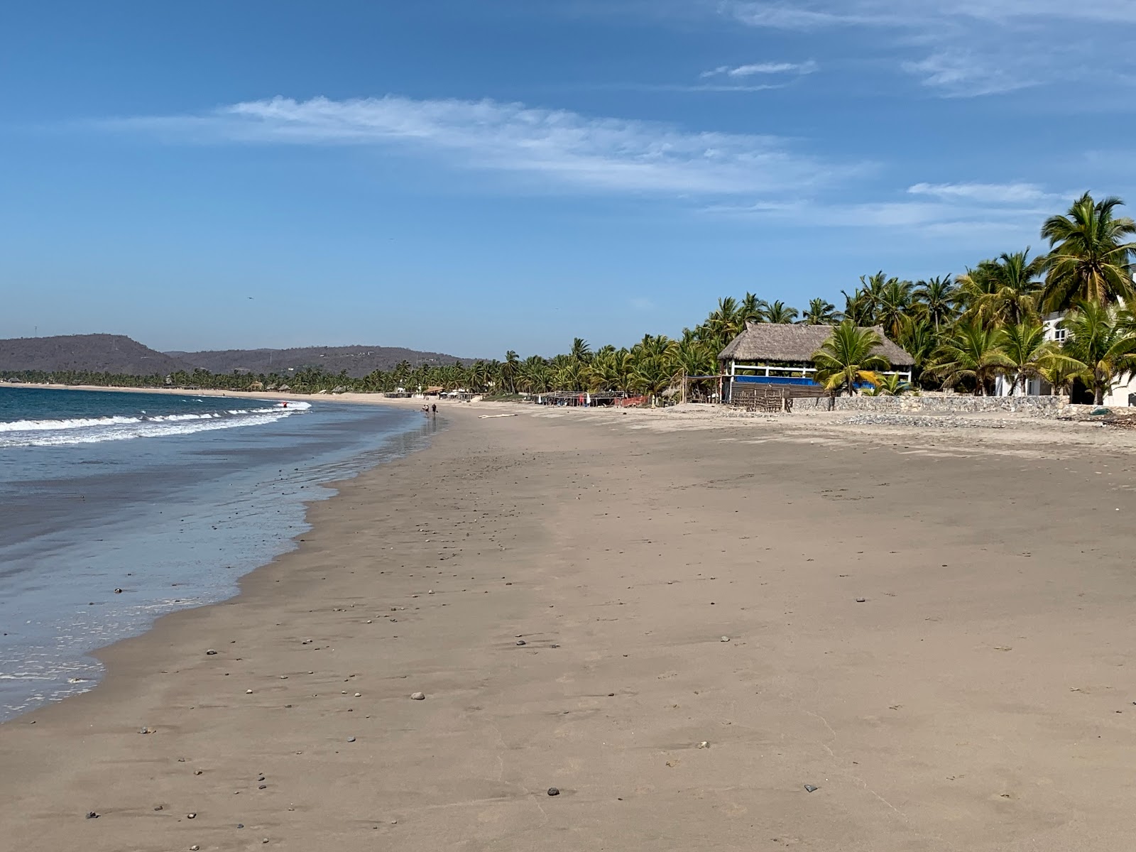 Fotografie cu Playa La Manzanilla cu o suprafață de nisip maro fin