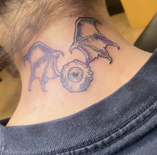 Explore knee scar tattoo ideas, creative tattoo ideas in Houston, available at 333 Tattoo Studio HTX