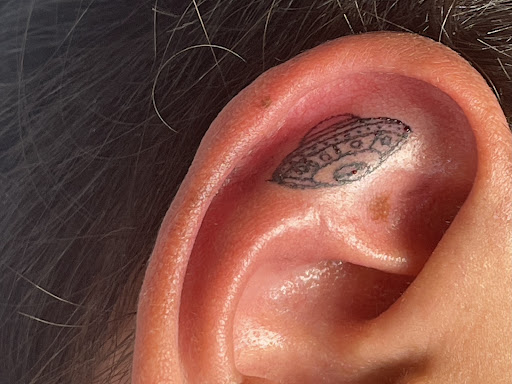 Explore neck tattoo ideas for females, creative tattoo ideas in Avon, available at Avanti Tattoo