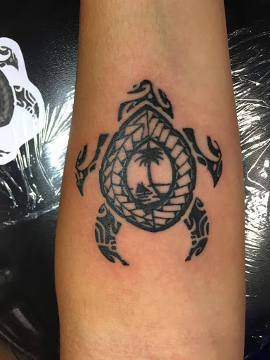 Explore motorbike tattoo ideas, creative tattoo ideas in Foley, available at Black Sheep Custom Tattoos and Piercings