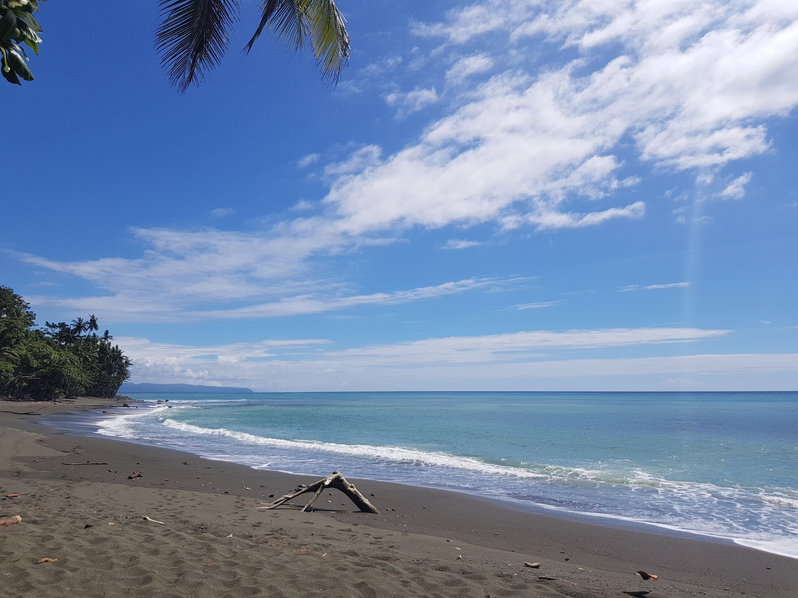 Photo de Playa Paraiso avec sable brun de surface