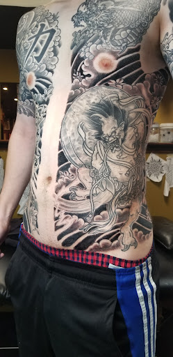 Explore backpiece tattoo ideas, creative tattoo ideas in Charleston, available at Broken Lantern Tattoo