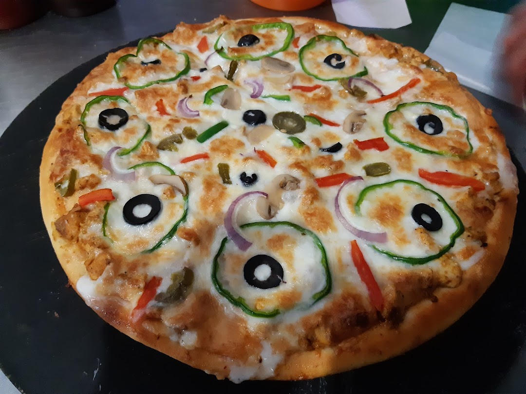 Cheezoo Pizza Kitchen by Shujaa