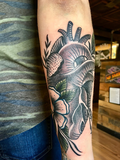 Explore tattoo cover ideas, creative tattoo ideas in Lees Summit, available at Bleeding Heart Tattoo