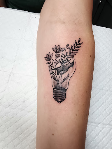 Explore half leg sleeve tattoo ideas for men, creative tattoo ideas in Minocqua, available at Walking Arts Tattoos