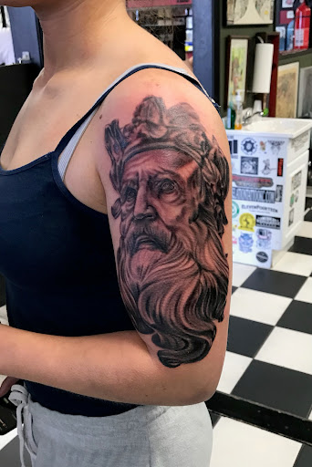 Explore feather memorial tattoo ideas, creative tattoo ideas in Kansas City, available at Revelation Tattoo