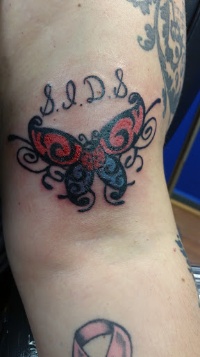 Explore female side tattoo ideas, creative tattoo ideas in Easton, available at Tattoo Factory