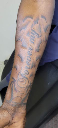 Explore cover up tattoo ideas back, creative tattoo ideas in Angola, available at Hoodlum Ink