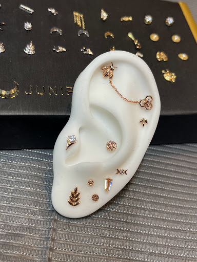 Explore female neck tattoo ideas, creative tattoo ideas in Bloomington, available at Crystal Moon Body Arts