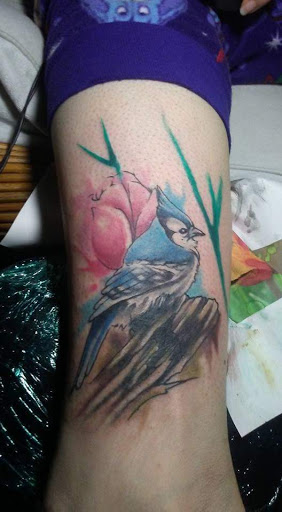 Explore flower and butterfly tattoo ideas, creative tattoo ideas in Daytona Beach, available at Studio 21 Tattoo & Piercings Daytona Beach