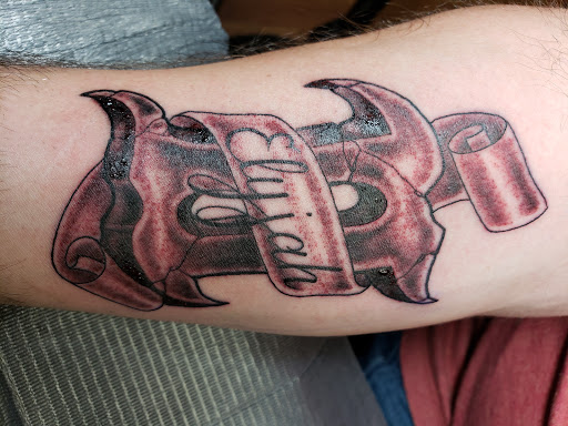 Explore purple heart tattoo ideas, creative tattoo ideas in Rochester, available at Physical Graffiti Tattoo Studio