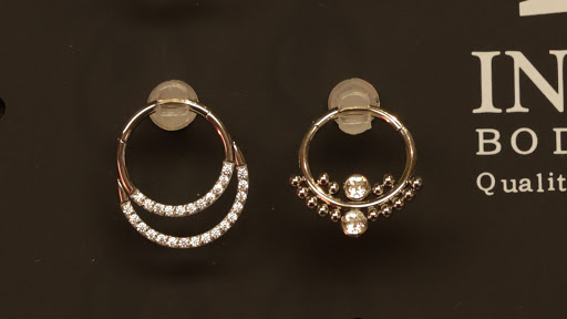 Explore side of the hand tattoo ideas, creative tattoo ideas in Des Moines, available at Axiom Body Piercing Studio