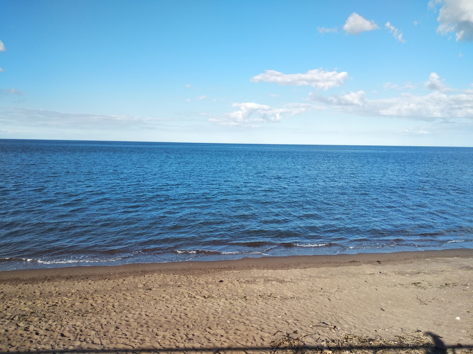 Foto van Spittal beach met recht en lang