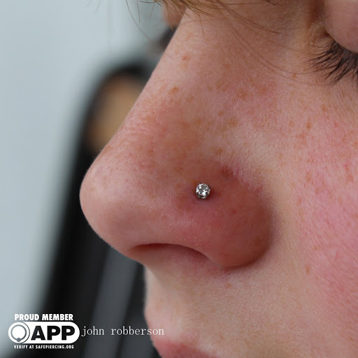 Explore cancer ribbon tattoo ideas, creative tattoo ideas in Fort Myers, available at Tiger Lotus Tattoo and Piercing