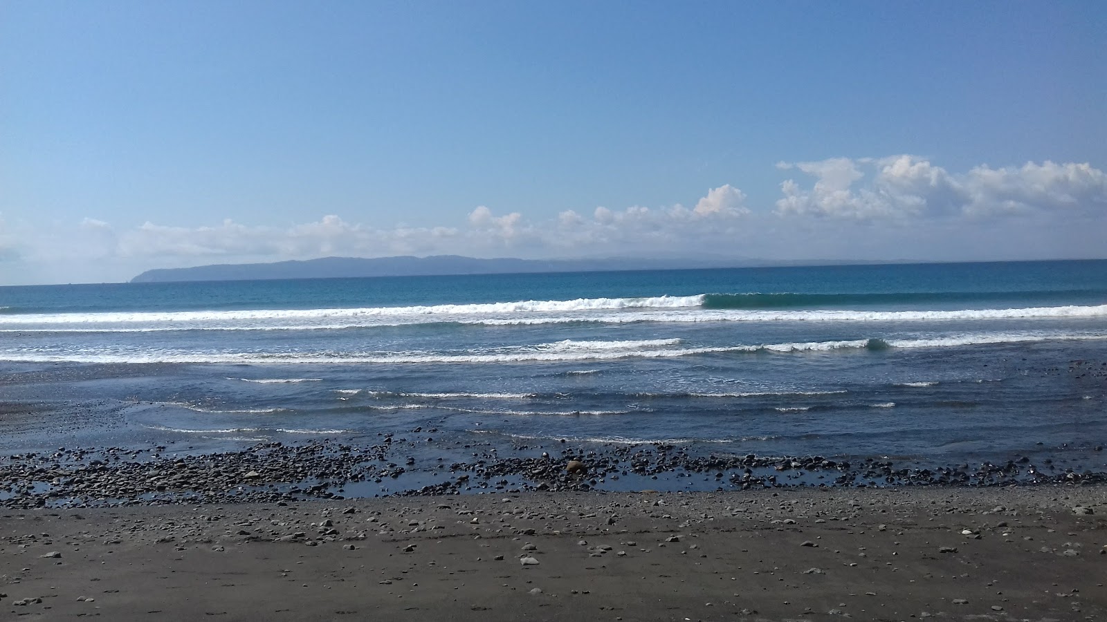 Foto van Playa Pavones met turquoise water oppervlakte