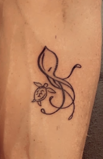 Explore forearm watercolor tattoo ideas, creative tattoo ideas in Davenport, available at Fine Ink Studios Tattoos