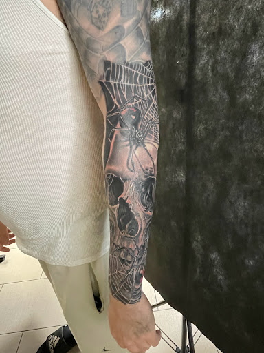 Explore tattoos for son ideas, creative tattoo ideas in Sarasota, available at SEVEN SINS Tattoo Studio